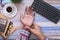 Businessman pain in hands while woking on desk