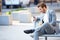 Businessman On Park Bench With Coffee Using Mobile Phone