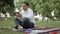 Businessman at the park with tablet. Young businessman at the park working with tablet