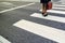 Businessman on pedestrian zebra crossing on his way to work