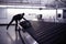 Businessman picking up suitcase on luggage conveyor belt, airpor