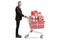 Businessman with a pile of presents in a shopping cart