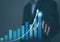 Businessman plans an effective digital stock market analysis strategy showing positive technology charts. Stock growth development