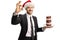 Businessman with a plate of donuts wearing a Santa Claus hat and gesturing sign perfect with fingers