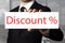 Businessman pointing on sign discount percentage symbol