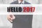 Businessman pointing words Hello 2017