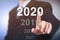 Businessman pointing year 2020. Businessman new year concept.