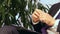 Businessman or politician giving live interview. Body language gesticulation with hands. Close up shot.