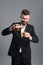 Businessman pouring whisky into glass