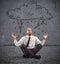 Businessman practice yoga under a rainy cloud