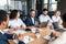 Businessman Presenting Startup Idea To Coworkers During Corporate Meeting Indoor