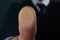 Businessman pressing control glass of biometric fingerprint scanner, closeup.