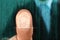 Businessman pressing control glass of biometric fingerprint scanner, closeup