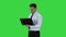 Businessman pressing play button to start or initiate projects or presentation on laptop on a Green Screen, Chroma Key.