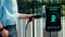 Businessman pull out EV charger from charging station, Peruse