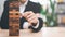 Businessman pulling a jenga wooden box,financial risk management and strategic planning,through data analysis for continuous