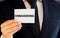 Businessman putting a card with text Onboarding in the pocket