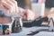 Businessman putting coins into glass jar ,and calculate the profit growth of savings,progressive concepts for the development of