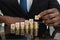 Businessman Putting The Letters Of The Word Budget On Coins