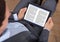 Businessman reading ebook in office