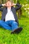 Businessman relaxes on a lawn