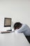 Businessman Resting At Office Desk