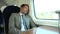 Businessman Resting On Train Journey