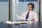 Businessman Reviewing Documents At Conference Table