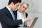 Businessman reviewing work with female colleague.