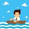 Businessman rowing a boat in the middle of the sea