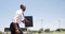 Businessman running with briefcase