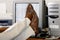 Businessman\'s Feet Propped Up On The Desk