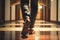 A Businessman’s Feet Walk Down the Brown Hallway of the Office - Generative AI