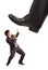 Businessman\'s foot stepping on tiny businessman