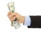 Businessman\'s hand grasping a handful of dollars