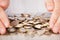 Businessman\'s Hands Collecting Euro Coins