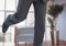 Businessman\'s legs running in office