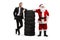 Businessman and Santa Claus leaning on a pile of tires