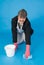 Businessman scrubbing floor