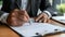 a businessman sealing the deal with a signature on a partnership contract in a modern office