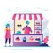 Businessman sells pastry in small store. Professional pastry chef stands in uniform. Concept of confectionery business and sweets