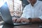 Businessman sending emails at table, closeup