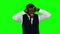 Businessman shouting the hands on his ears. Green screen
