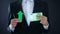 Businessman showing euro banknote and green arrow sign, currency growing, income