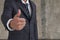 Businessman showing thumbs up sign.thumbs-up is a sign that you make by raising your thumb for showing that you happy with idea or