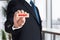 Businessman shows a wooden block with the word invest. Financial investment decision