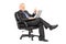 Businessman sitting in an armchair with a laptop