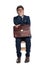 Businessman sitting with briefcase on laps holding hand over face