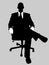 Businessman sitting in a chair with a gray background
