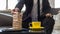 Businessman sitting in office building a tower of stacked blocks